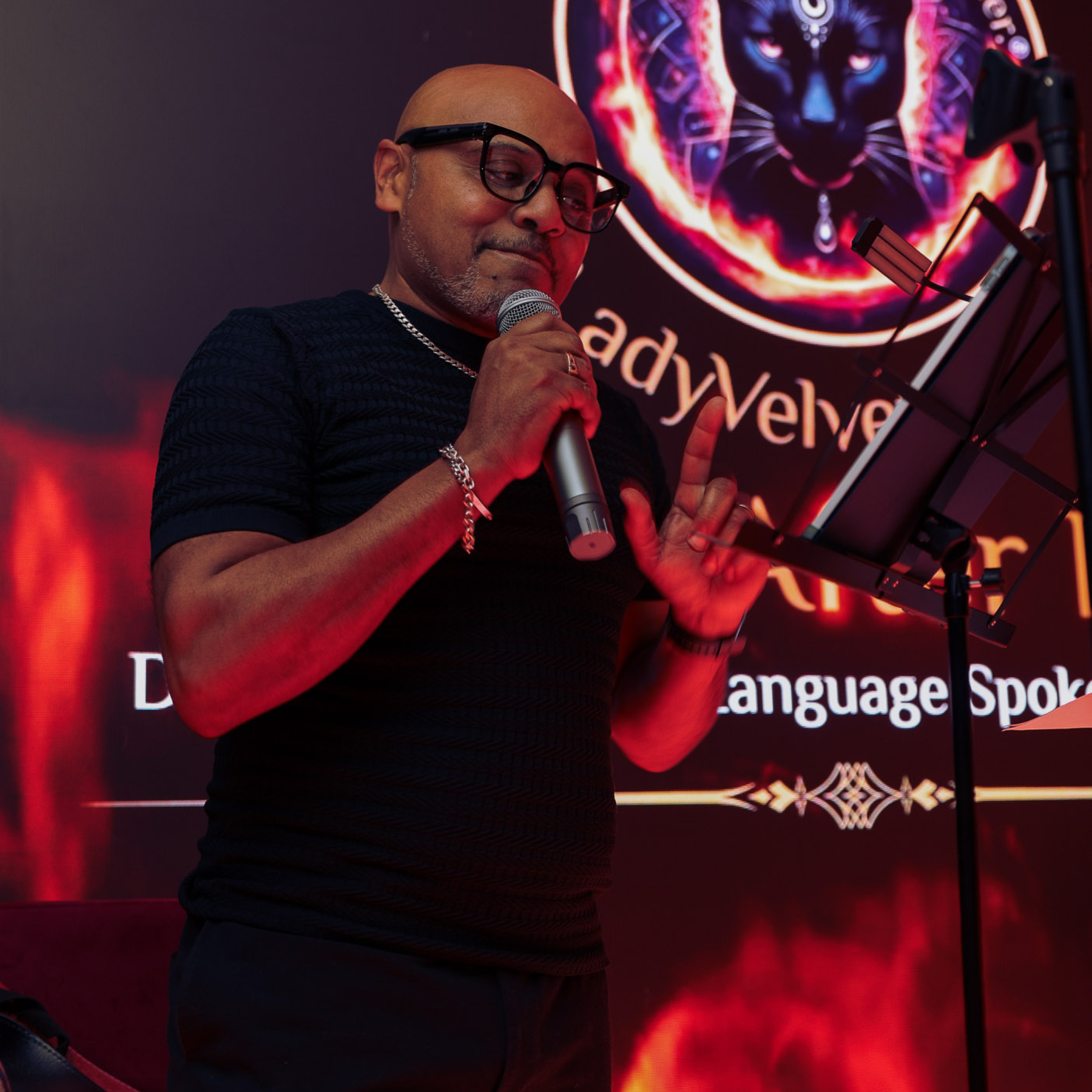 Lady Velvet speaking on stage at Velvet After Dark London erotic spoken word event