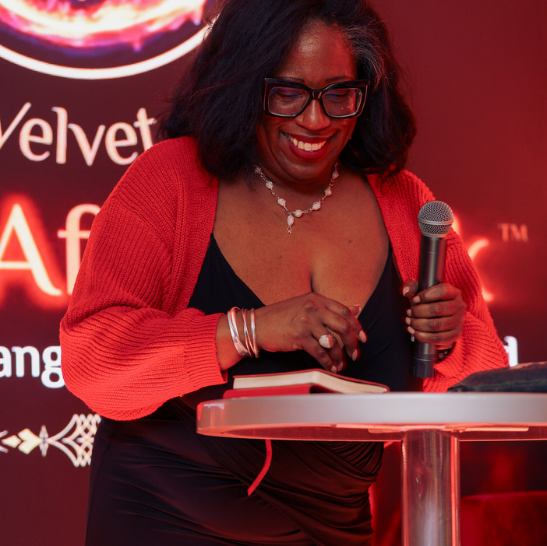 Lady Velvet speaking on stage at Velvet After Dark London erotic spoken word event
