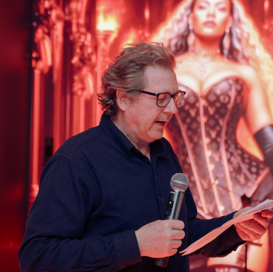 Lady Velvet speaking on stage at Velvet After Dark London erotic spoken word event