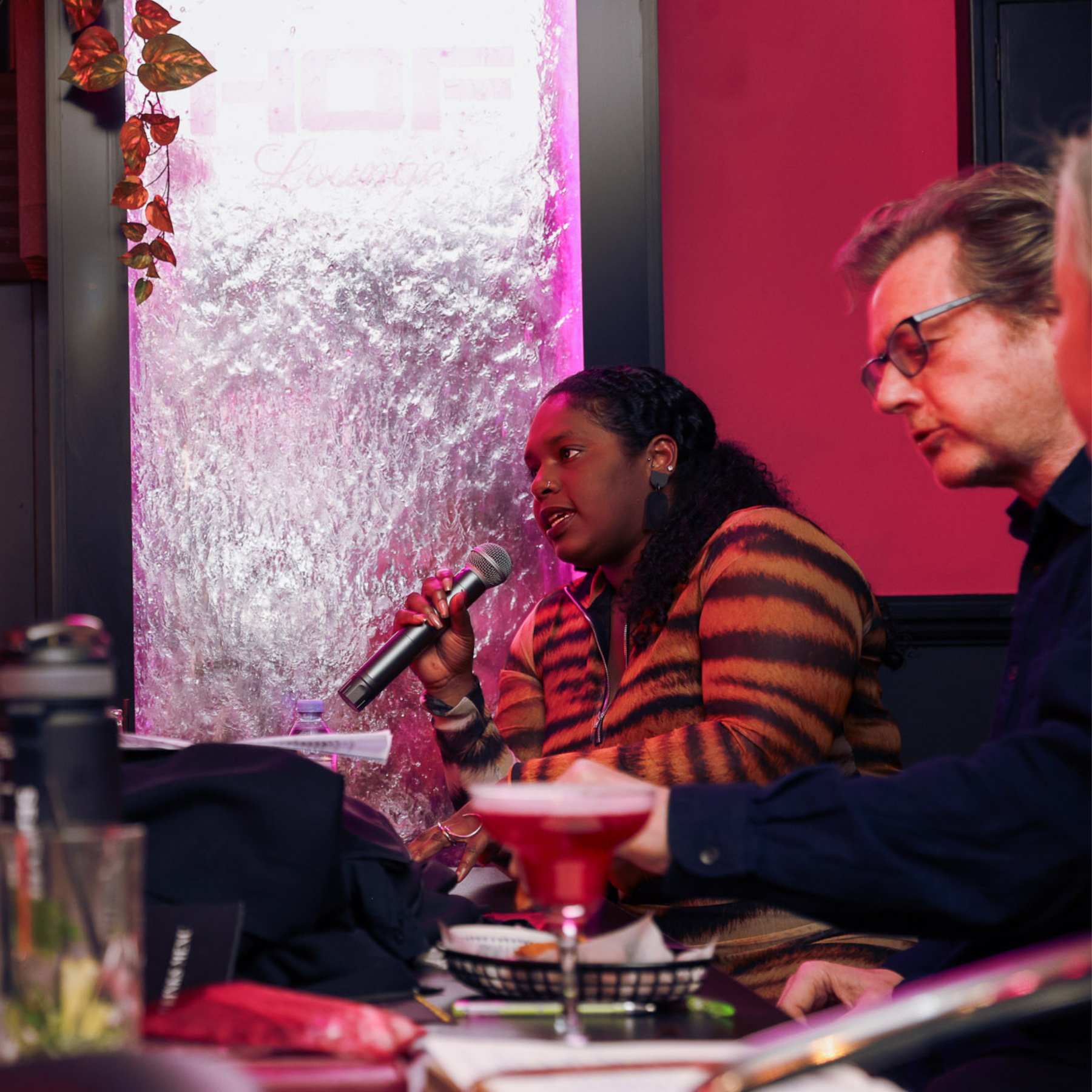 Lady Velvet speaking on stage at Velvet After Dark London erotic spoken word event